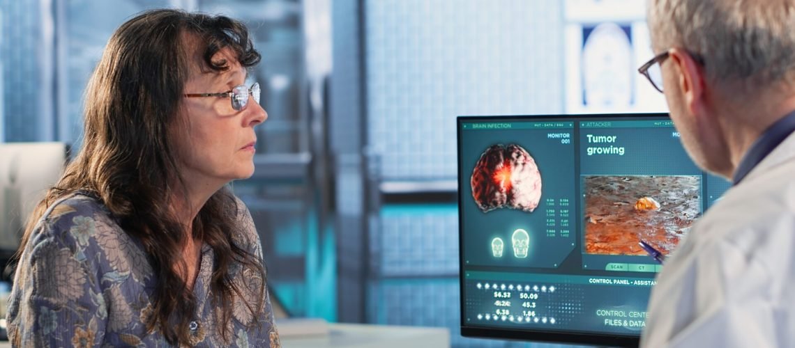 Physician consulting a patient about an MRI scan providing diagnostics insights into tumor growth and potential chemotherapy options in a modern healthcare office. Recommendations. Camera B.